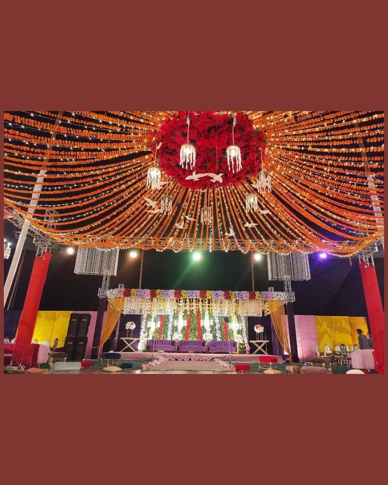 Mehndi canopy of marigold strings and fairy lights by Wedding Alley